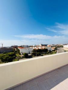 a balcony with a view of a city at SOHO Rooftop 360 Sunset Edition in Essaouira