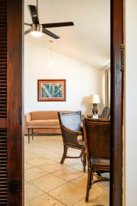 a living room with a desk and a couch at Villa Costera 904 | Island Escapade | Culebra in Culebra