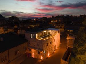 a view of a building at night with lights at İsadora Cave Cappadocia in Nevşehir