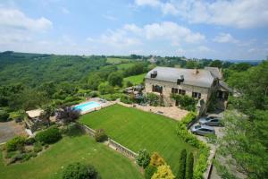 an aerial view of a house with a large yard at Soulages in Najac