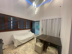 a bedroom with a bed and a table in it at Departamento MG in Puebla