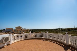 a white bridge over a brick walkway at Enjoy complete seclusion at Casa Delfin, featuring your own stunning private pool and sunset views in Gran Alacant