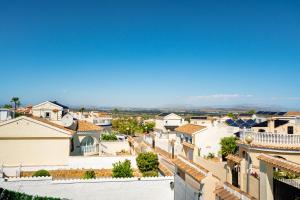 a view from the roof of a town at Enjoy complete seclusion at Casa Delfin, featuring your own stunning private pool and sunset views in Gran Alacant +28 photos