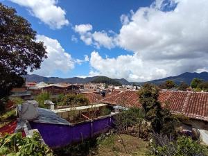a view of a city with buildings and mountains at Casa Josvic in San Cristóbal de Las Casas +16 photos