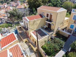 an overhead view of a house with orange roofs at BellaDiAnna Apartment in Symi
