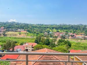 a view of a town with houses and roofs at Centenary Gardens BnB in Kigali