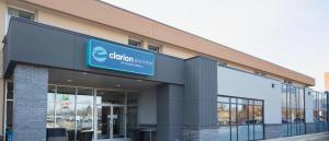 a building with a sign on the front of it at Clarion Pointe in Winnipeg
