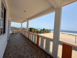 a balcony of a house with a view of the beach at Casa paraíso escondido in Coyote