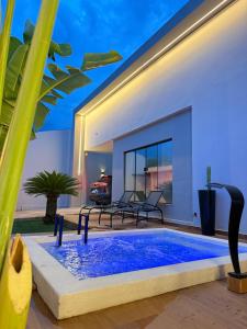 a swimming pool in the backyard of a house at Studio Aeroporto in Teresina