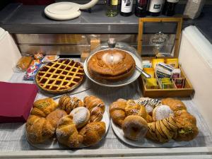 a bunch of different types of bread and pastries at La Lanterna di Guiglia in Guiglia +16 photos