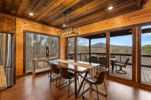 a kitchen and dining room with a table and chairs at 249 Ranger Station in Morganton