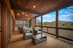 a screened in porch with a view of the mountains at 249 Ranger Station in Morganton