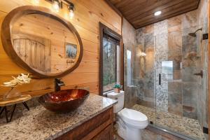 a bathroom with a sink and a toilet and a mirror at 249 Ranger Station in Morganton +51 photos