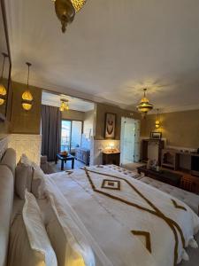 a large bedroom with a large bed in a room at Ksar Sultan Dades - Dades Valley Retreat in Boumalne Dades +119 photos