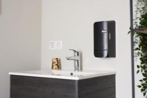 a sink with a faucet in a bathroom at Herberg, Het Wapen van Tilburg in Tilburg