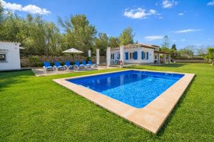 a swimming pool in the yard of a house at M014 Paraiso by Mallorca Villa Selection in Alcudia