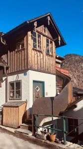 a house that is being built on top of a truck at PinkDeer in Hallstatt