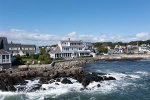 a group of houses on the shore of a body of water at Mother`s Beach House in Kennebunk