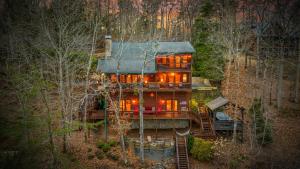 a house in the middle of a forest at Johnny's Lakeside Hideaway in Morganton