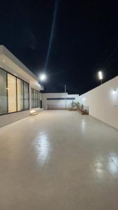 a large empty parking lot at night at top one in Taif