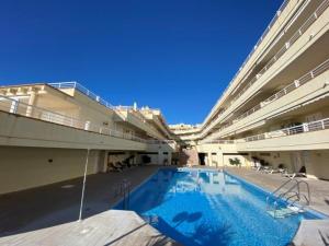a large swimming pool in a large building at Cala Montero - Inalko in Alcossebre