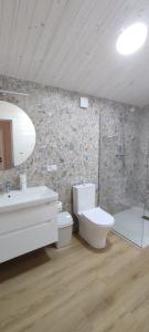 a bathroom with a toilet and a sink at Садиба Пташка in Krivopolʼye +6 photos