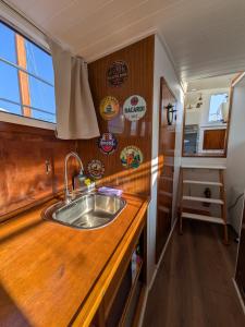 a kitchen with a sink and a wooden counter top at Over the Sea in Barcelona