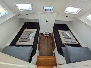 an overhead view of the inside of a boat with two beds at Over the Sea in Barcelona