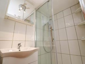 a bathroom with a sink and a shower at St Dominic Cottage in St Ives +17 photos