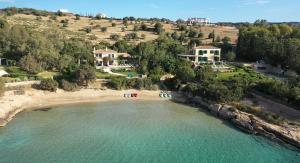 an aerial view of a beach with people on it at Aria & Iris in Kilada