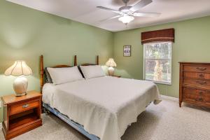 a bedroom with a bed and a ceiling fan at Saltwater Pool! Sebring Oasis Near Lake Jackson in Sebring