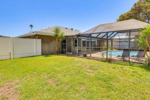 a house with a swimming pool and a fence at Saltwater Pool! Sebring Oasis Near Lake Jackson in Sebring