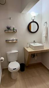 a bathroom with a white toilet and a sink at Star Department We bill in La Paz