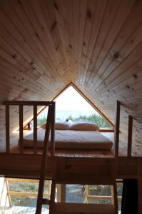 Postel nebo postele na pokoji v ubytování The ZzzzMoose 2 0 Camping Cabin + 19 fotografií