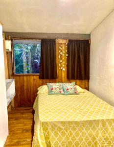 a bedroom with a bed and a window at Beautiful Second Story Apartment 202 Next to Playa Flamingo in Playa Flamingo +28 photos