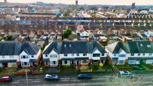 an aerial view of a city with houses and cars at Central Taunton Townhouse in Taunton
