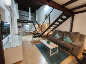 a living room with a couch and a table at El Patio del Convento in Toledo