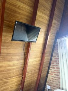 a flat screen tv on the ceiling of a room at Casa Alpina in Navarro
