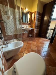 a bathroom with a toilet and a sink at Palazzo Mascambruno in Cariati +56 photos