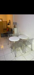 two tables and two chairs in a room at Nid douillet in Montpellier
