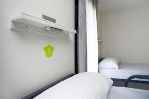Posteľ alebo postele v izbe v ubytovaní Meeting Point Hostels