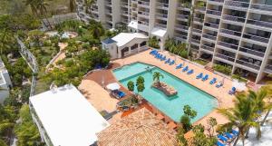 an overhead view of a pool at a resort at Oceanview large studio, pool, walk to Mullet Bay, Cupecoy Beach, walk to dining, free parking in Cupecoy