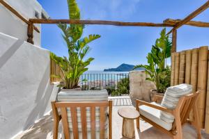 a patio with two chairs and a table at Santa Barbara by Santas Hotels in Altea