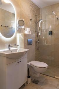a bathroom with a sink and a toilet and a shower at Peace 2 Apartments with parking in Budva +39 photos