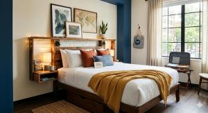 a bedroom with a large bed with blue walls at Hotel Taj Vista by Navodyans Near Taj Mahal in Agra