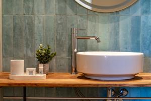 a sink on a wooden counter in a bathroom at Santa Barbara by Santas Hotels in Altea