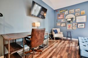 a room with a desk and a chair at Urban Collective Boutique Hotel in Edwardsville