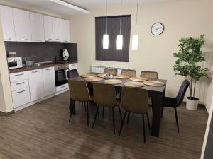 a kitchen with a dining room table and chairs at Guest houses Forte in Tsigov Chark