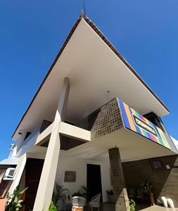 a large white building with a sign on it at Studio Sol in Mossoró