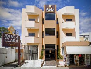 a building with a santa clara sign on it at Hotel Santa Clara in Aparecida